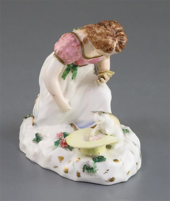 A Rockingham porcelain group of a kneeling girl playing with a kitten, c.1830, h. 10.5cm, small losses